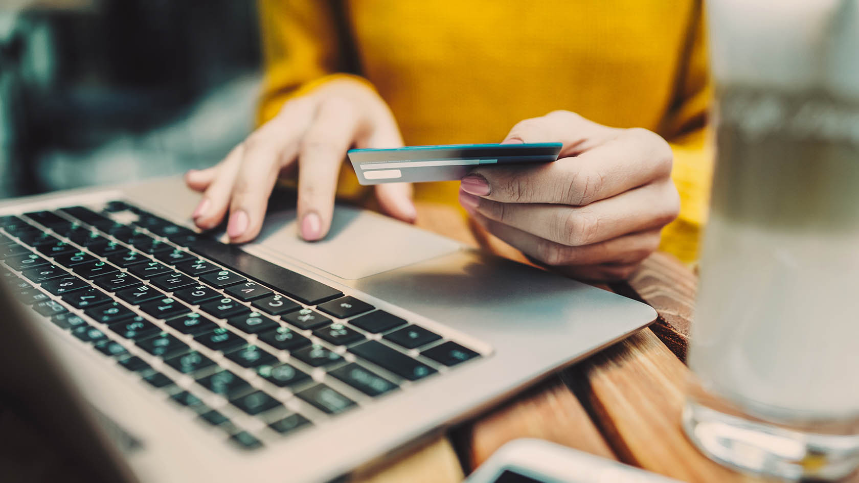 Laptop being used for online payment by a women